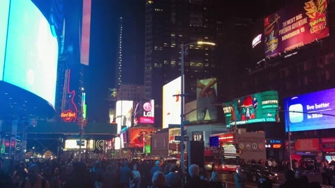 Crowd walks in Times Square at night Stock Footage 130896806