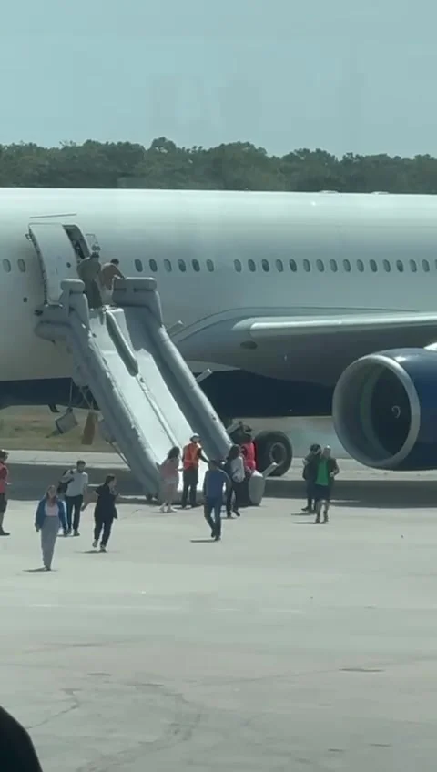 Crowd Watches Delta Plane Catch Fire From Airport Terminal, Orlando, Florida, US Stock Footage 307439508