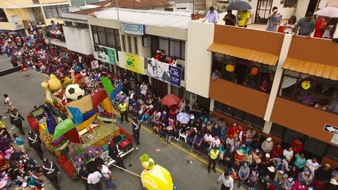Crowd Watches Float go by during Carnival Parade in Ambato Stock Footage 73037758