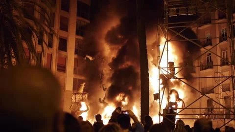 Crowd watching burning figure during Fallas Stock Footage 252499642