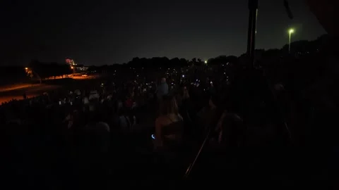 Crowd watching fireworks display at night Stock Footage 340942169