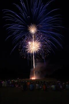 Crowd watching fireworks display Stock Photos