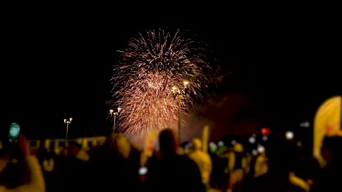 Crowd watching fireworks with phones. Stock Footage 343233861