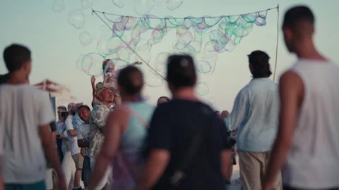 Crowd Watching Giant Soap Bubble Performance Stock Footage 340324222