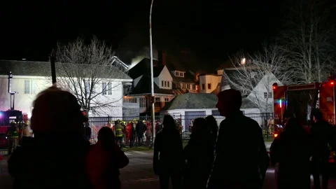 Crowd watching massive fire Stock Footage 139657090