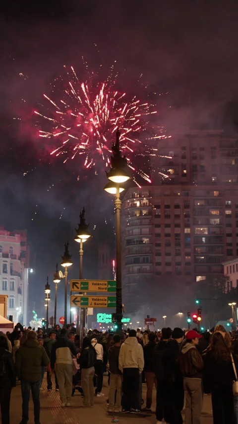 Crowd watching multiple fireworks above Valencia during Las Fallas la crema Stock Footage 334293868