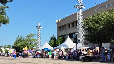 Crowd watching parade in front of City Hall building Stock Footage 340941576