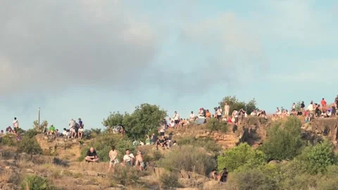 Crowd watching a solar eclipse from a hill in Sagunto, Spain Stock Footage 342277920