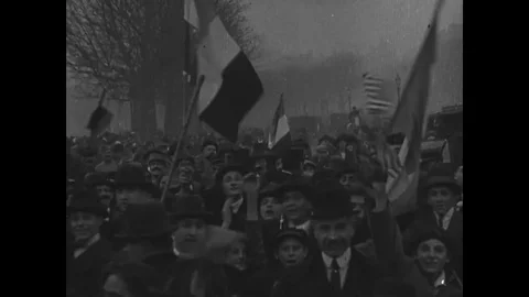 Crowd waving at the camera during Armistice celebration Stock Footage 83658804