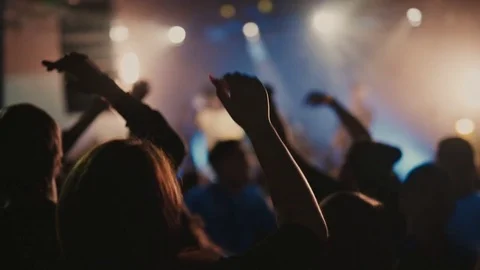 Crowd waving hands in the night club party Stock Footage