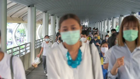 The crowd is wearing protective masks prevent Coronavirus, Covid 19 virus dur Stock Footage 126259059