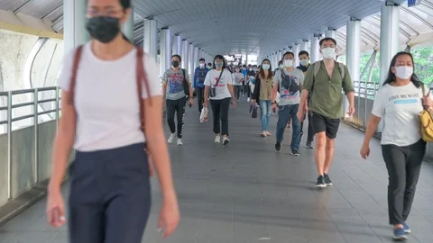 The crowd is wearing protective masks prevent Coronavirus, Covid 19 virus dur Stock Footage 126750171