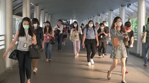 The crowd is wearing protective masks prevent Coronavirus, Covid 19 virus dur Stock Footage 126750247