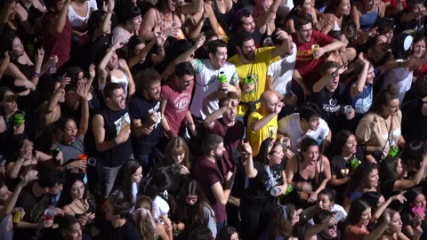 Crowd of young people dancing and singing, celebrating the festivities of san Stock-Footage 146748748