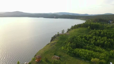 Crowd of young people dancing on a rock by the water Stock Footage 165526871
