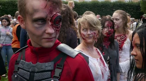 Crowd of Zombies make up during the preparation phase to go for a zombie walk Stock Footage 68703154