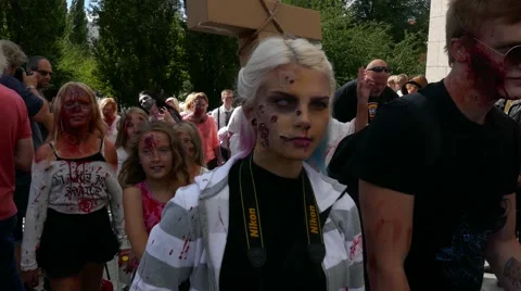Crowd of zombies marching and walking in the Stockholm zombie walk in streets Stock Footage 68703170