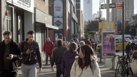 Crowded 6th Ave street fall people cell phones and smartphones New York City NYC Stock Footage 83115840
