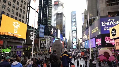 Crowded and busy Times Square in NYC. Tourists visiting famous landmark Stock Footage 200311117