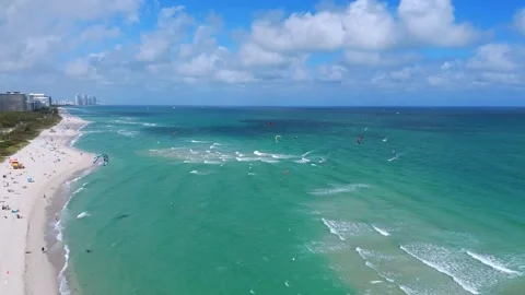 Crowded beach and oceanic landscape viewed from above. Video stock 264079713