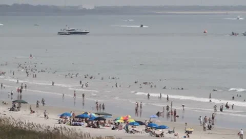 Crowded Beach with boats Stock Footage 8963383