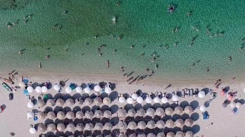 Crowded beach, lounge chairs on Pefkochori beach, Overhead aerial view Stock Footage 341992753