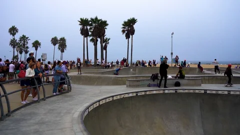 Crowded beach skatepark on a cloudy day Stock Footage 99157809