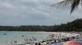 Crowded beach in summer, boat, ship, sunbathers, swim suit, swimming HD Footage