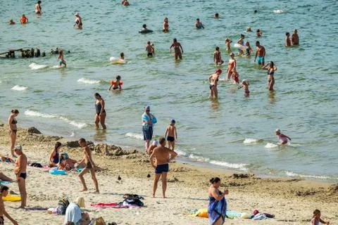 Crowded beach on summer day Stock Photos