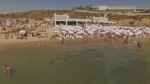 Crowded beach in Tel Aviv, drone footage 1080p 50p Stock Footage
