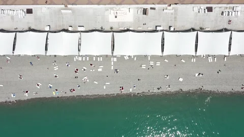 Crowded beach vacation top view. Having fun on beach summer. Aerial view. Top 動画素材 155069407