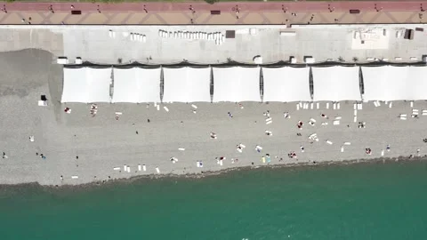 Crowded beach vacation top view. Having fun on beach summer. Aerial view. Top 動画素材 155069550