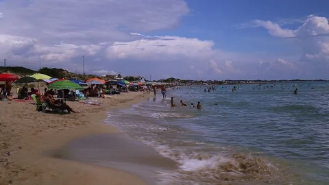 Crowded beach waves and clouds with audio Stock Footage 94865340