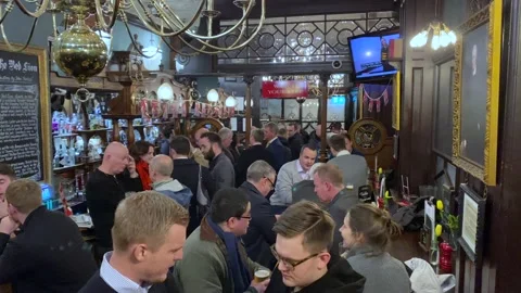 Crowded British Pub in London Stock Footage 154080110