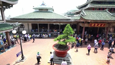 Crowded Buddhists visit temple to pray for peace Stock Footage 156725070