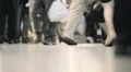 Crowded building interior legs feet people walk anonymous crowd commute NYC HD Footage