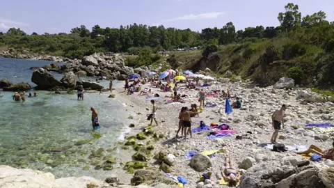 Crowded cala mazzo di sciacca beach, scopello Stock Footage 280876703