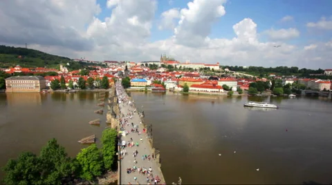 Crowded The Charles Bridge and Vltava river shore Video stock 54485887