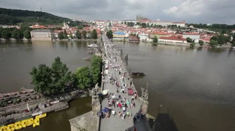 Crowded The Charles Bridge and Vltava river shore Video stock 56492833