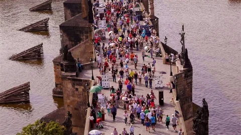 Crowded Charles Bridge in Prague – medium shot Stock Footage 82704199