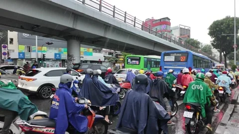 Crowded citizen moving on Sai Gon street in rainy day, people in raincoat r.. Stock Footage 282638721