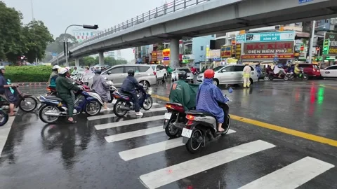 Crowded citizen moving on Sai Gon street in rainy day, people in raincoat r.. Stock Footage 282638877