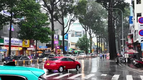 Crowded citizen moving on Sai Gon street in rainy day, people in raincoat r.. Stock Footage 282639049