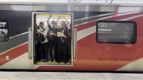 Crowded Commuter Train Door Filled With Passengers in Jakarta Stock Footage 337522181