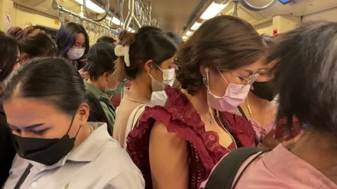 Crowded commuters riding on BTS sky trai... | Stock Video | Pond5