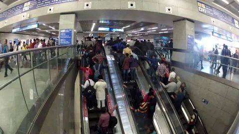 Crowded commuters riding on escalator inside subway station daytime Stock Footage 197004500