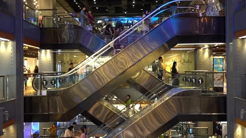 Crowded Consumer on escalators in shopping mall Stock Footage 94594843