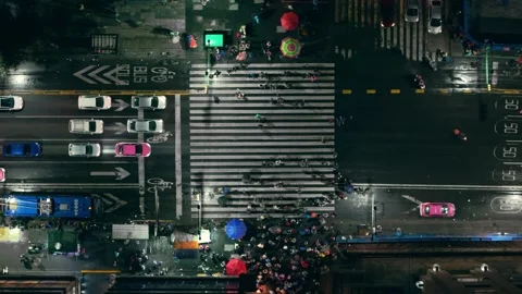 Crowded crosswalk on Eje Central in Mexico City at night, aerial view Stock Footage 313817124
