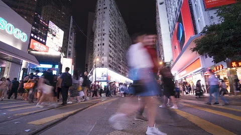 Crowded crosswalk time lapse. Intersection at night wide shot. Stock Footage 102019412