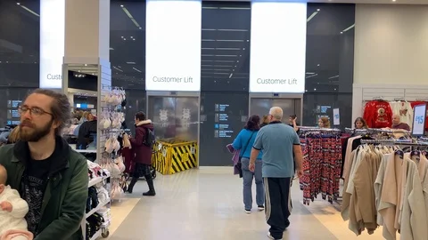 Crowded department store with elevator in background Stock Footage 117792020